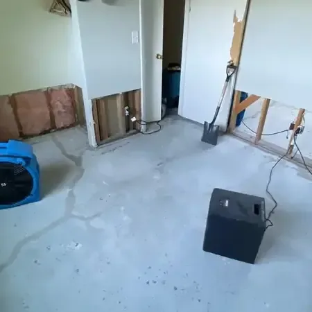 Extraction hose pulling storm water out of a garage and lower level